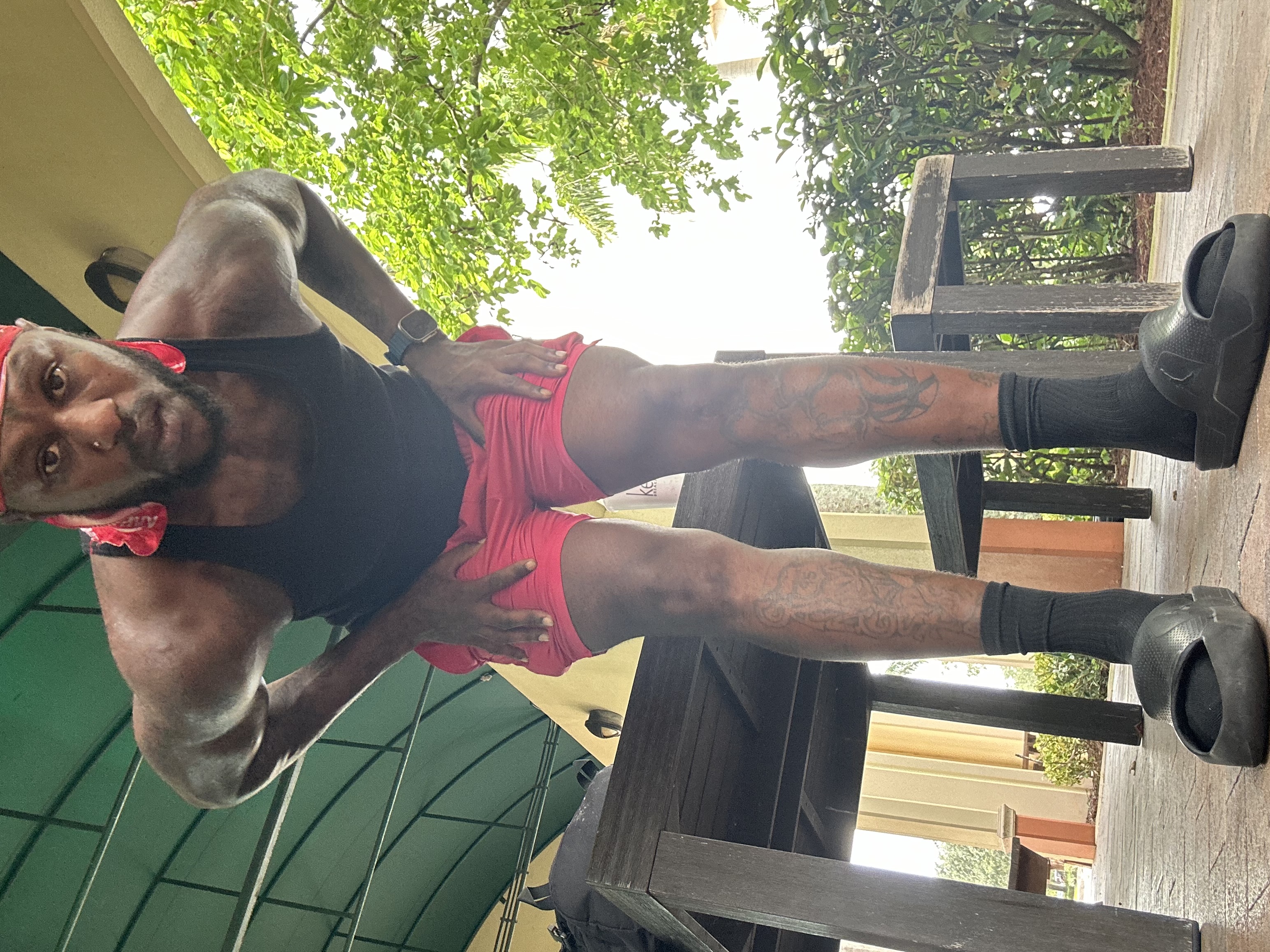 Sahun Rattary training outdoors in a black tank top
